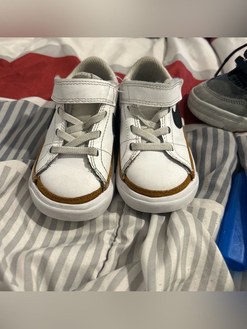 Nike Kids White Sneakers with Brown Accents and Black Swoosh